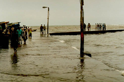 Tide coming in at a street market in Bombay