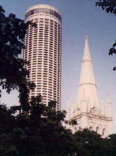 Church of England steeple next to modern Singapore