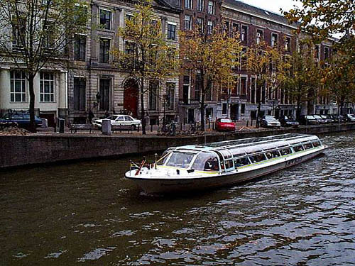 One of Amsterdams canal tour boats 
  